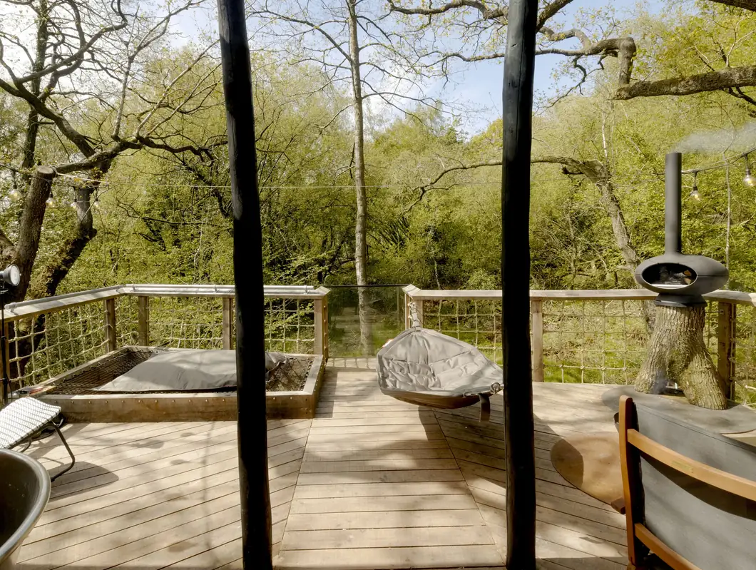 The cargo-net day bed suspended over the stream