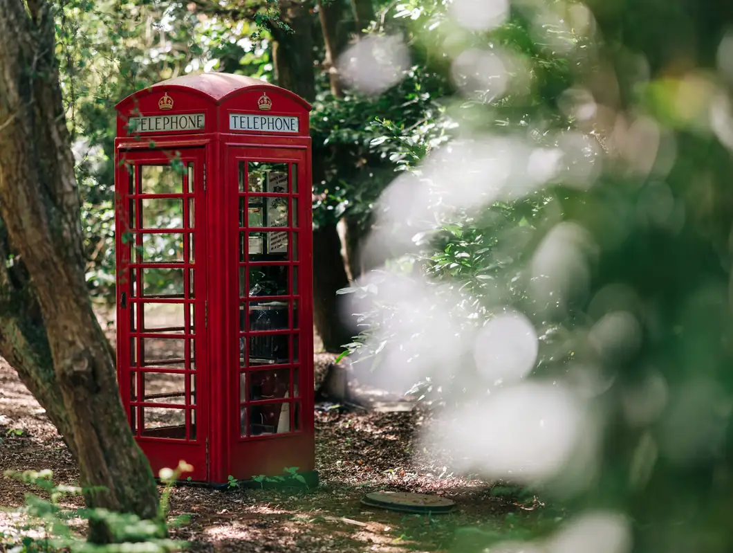 The red telephone box in the woodland, home of the Call Beyond the Lamp Post escape game