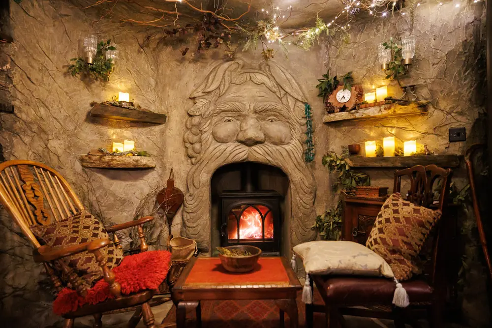 The fireplace and carved Green Man in the treehouse