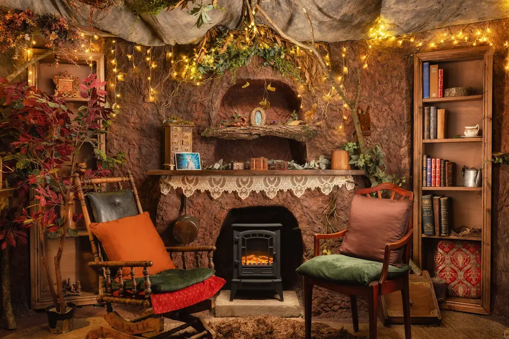 Fairy lights and a lit fire inside Faun’s Hideaway