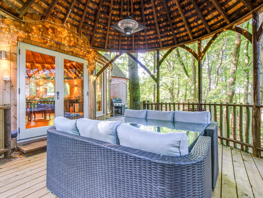 Relax on the balcony looking down into the woods