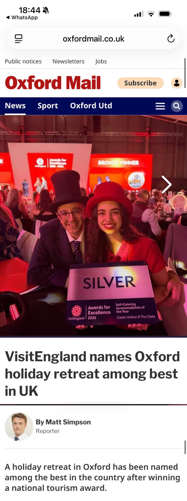 Oxford Mail article on a phone screen: 'VisitEngland names Oxford holiday retreat among best in UK', with the Cedar Hollow team holding the Silver award