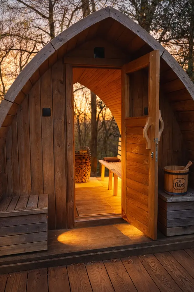 The bastu lit from within, its door open
